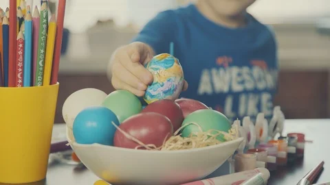 Little boy painting easter eggs Stock Footage 126284098
