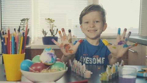Little boy painting easter eggs Stock Footage 126284246
