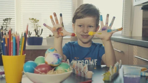Little boy painting easter eggs Stock Footage 126284296