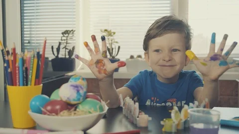 Little boy painting easter eggs Stock Footage 126284315