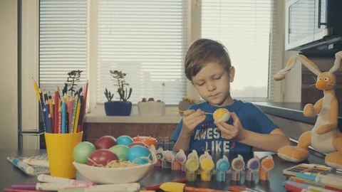 Little boy painting easter eggs Stock Footage 126284347
