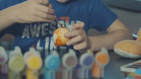 Little boy painting easter eggs Stock Footage 126284532