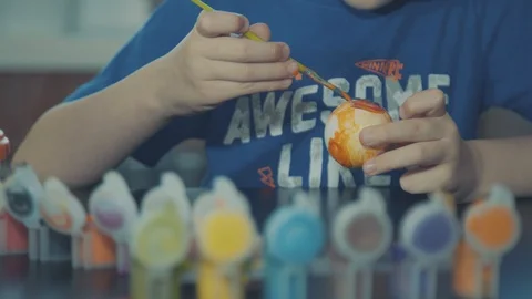 Little boy painting easter eggs Stock Footage 126284564