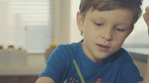 Little boy painting easter eggs Stock Footage 126284624