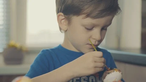 Little boy painting easter eggs Stock Footage 126284667