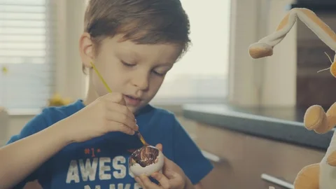 Little boy painting easter eggs Stock Footage 126284697