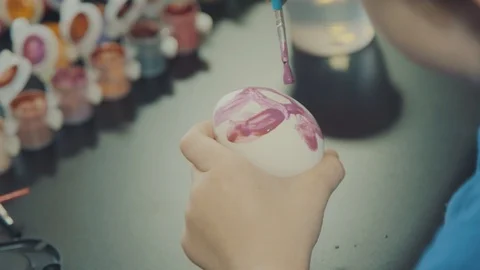 Little boy painting easter eggs Stock Footage 126332404