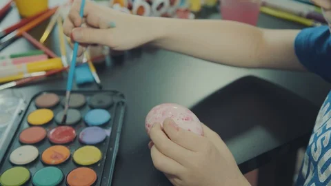 Little boy painting easter eggs Stock Footage 126334332