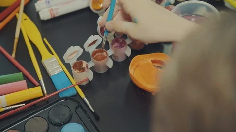 Little boy painting easter eggs Stock Footage 126334391