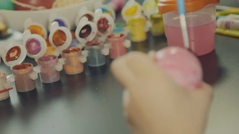 Little boy painting easter eggs Stock Footage 126334528