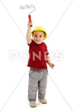 Little boy painting with paint roller Stock Photos