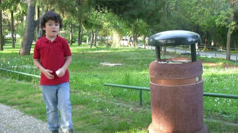 Little boy Picking Up Litter Stock Footage 22958835