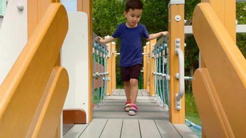Little boy on the playground Stock Footage 154849766