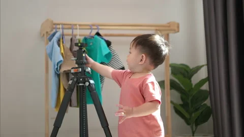 Little boy playing before bathing him Stock Footage 310078799