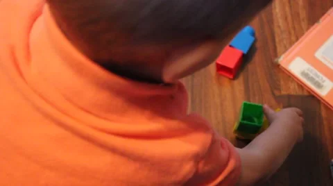 Little boy playing with blocks Stock Footage 44445718