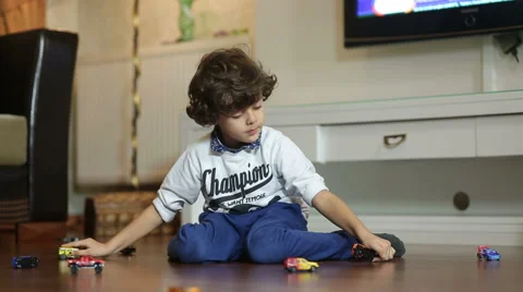 Little boy is Playing with car Stock Footage 44340577