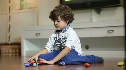 Little boy is Playing with car Stock Footage 44340628