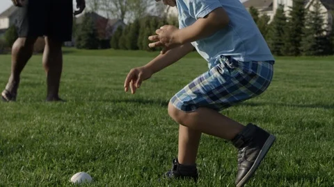 Little boy playing catch and having fun in the yard with dad Stock-Footage 89922965