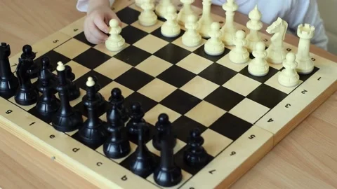 A little boy is playing chess with dad at home.Joint family leisure. Stock Footage 150480754