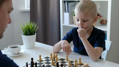 Little boy playing chess with his father. Education and family concept Stock-Footage 104176872