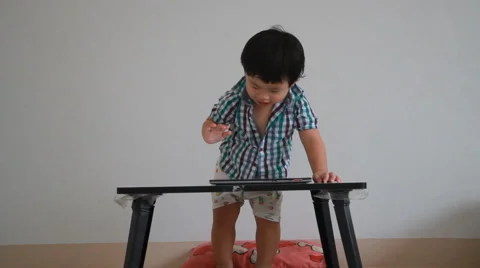 Little boy playing computer games on tablet Stock Footage 55396484