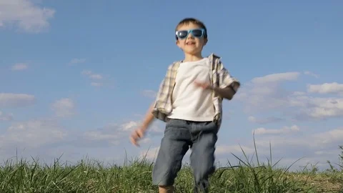 Little boy playing on the field at the day time. Stock Footage 74909984