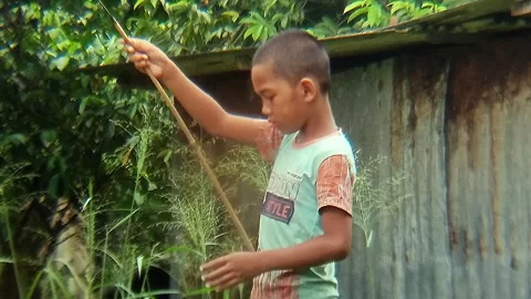 Little boy playing fishing in a small lake. Stock Footage 310057504