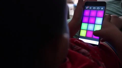 Little boy playing game on mobile phone Stock Footage 65300899