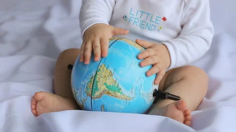 Little boy playing with an  globe Stock Footage 56053526