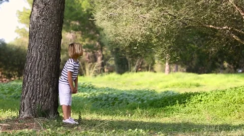 Little boy playing hide and seek Stock Footage 57108628