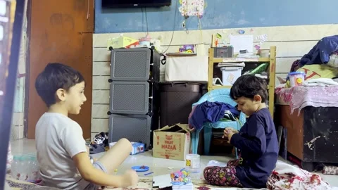 Little Boy Playing with His Sister in Room Showing Happy Childhood Stock Footage 346127731