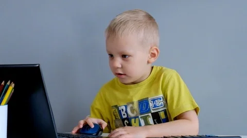 Little Boy Playing with Laptop Vídeo Stock 87729127