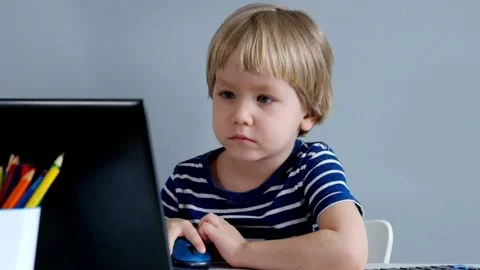 Little Boy Playing with Laptop Vídeos de archivo 87744262