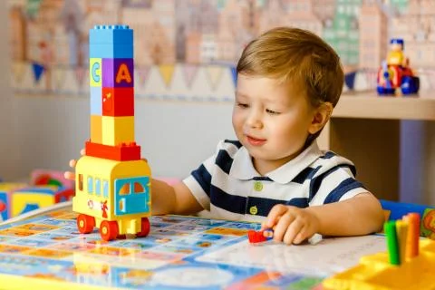 Little boy playing in the machine Stock Photos