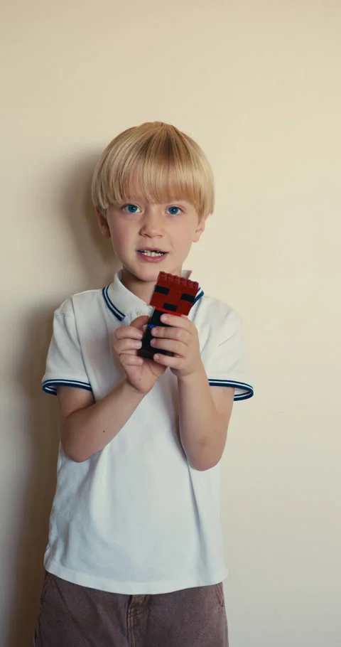 Little boy playing with a minecraft character toy Stock-Footage 346983438