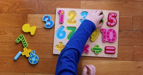 A little boy  playing on numeric board on the floor. Stock Footage 184521947