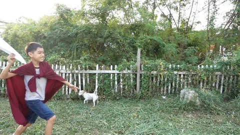 Little boy playing paper rocket in the park Stock-Footage 100751282