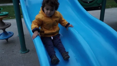 Little boy is playing on the playground Stock Footage 82484586