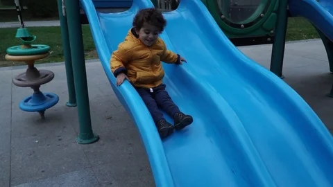 Little boy is playing on the playground Stock Footage 82484608