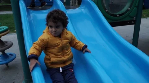 Little boy is playing on the playground Stock Footage 82484625
