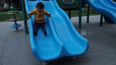 Little boy is playing on the playground Stock Footage 82484647