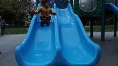 Little boy is playing on the playground Stock Footage 82484741