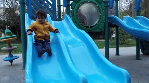 Little boy is playing on the playground Stock Footage 82484978