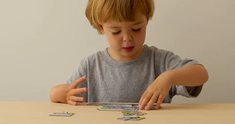 Little boy playing with puzzle Video stock 110989165