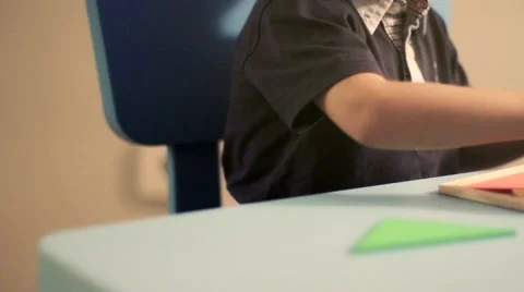 Little boy  playing with puzzle on a table Stock Footage 42256694