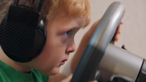 Little Boy Playing Races On Computer Stock Footage 168884555