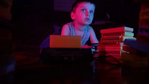 Little boy playing retro console, lost and disappointed Stock Footage 126268952