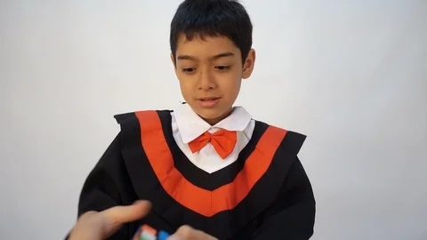 Little boy playing Rubik cube Stockbeeldmateriaal 102412435