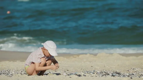Little boy playing in the sand on the beach Stock Footage 24124124