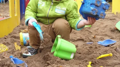 Little Boy Playing In A Sandbox Stock Footage 68631392